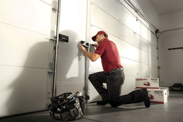 This is an image of a garage door repairman.