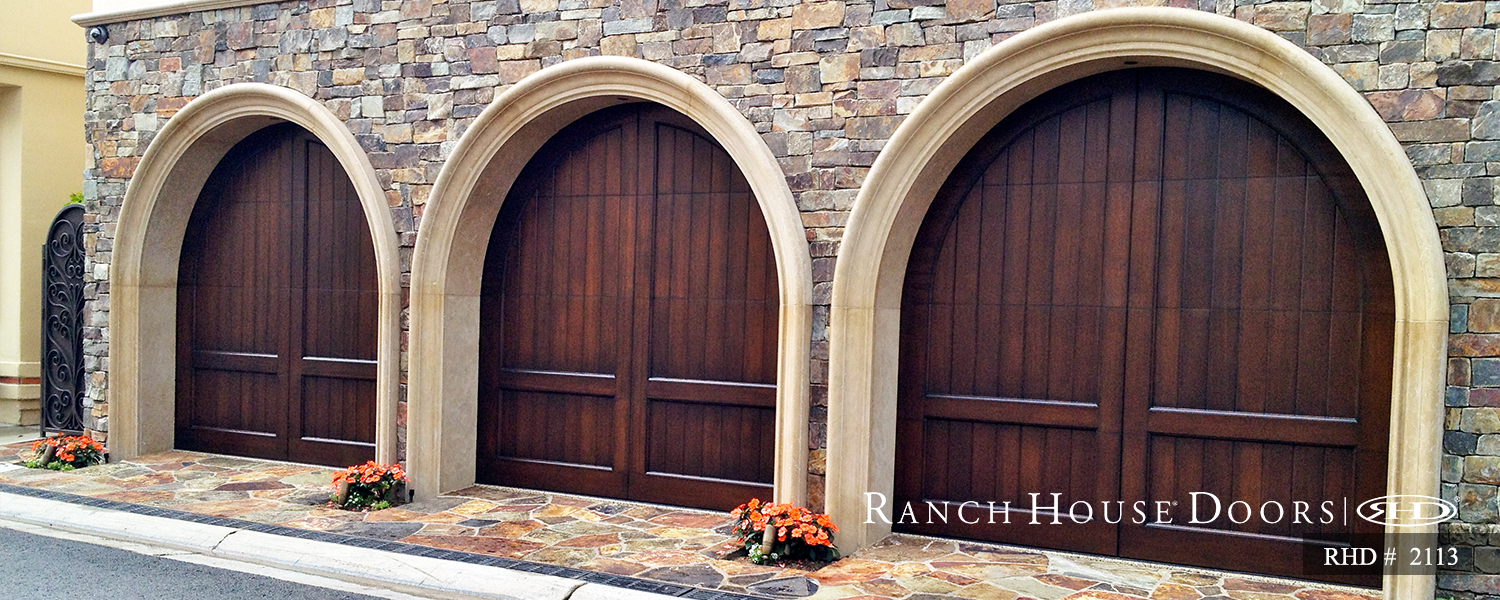 This is an image of a wood Spanish style garage door in San Juan Capistrano, CA.