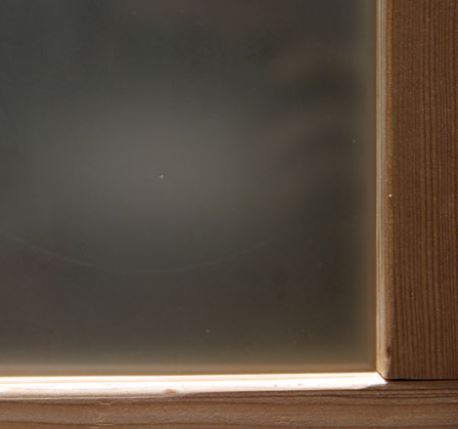 This is an image of a type of garage door window glass: frosted acid etch.