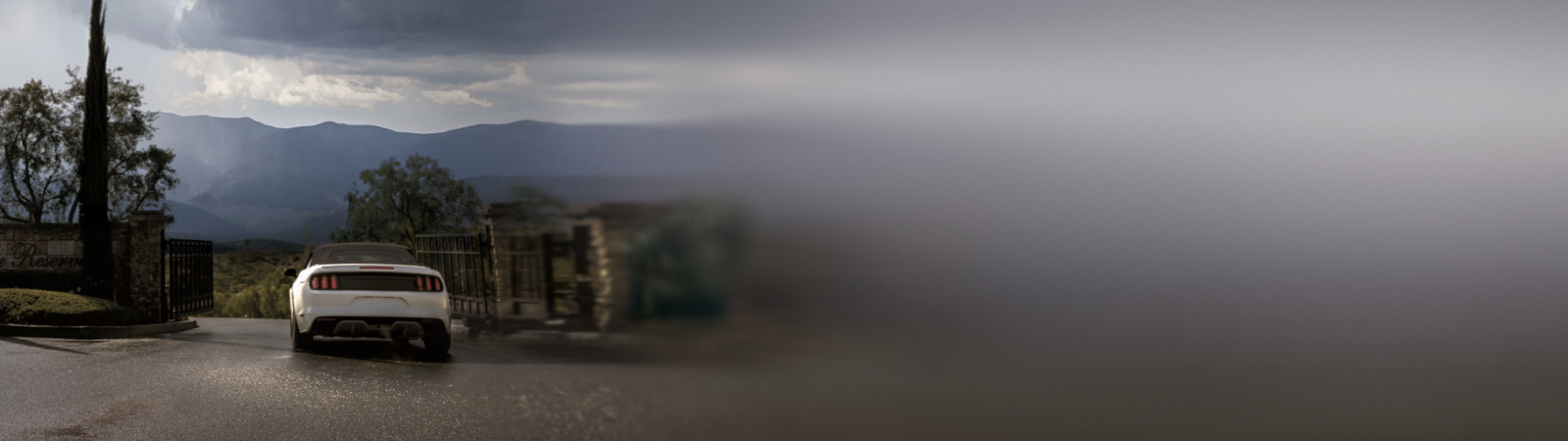 This is an image of a car entering a property through an automatic gate system.