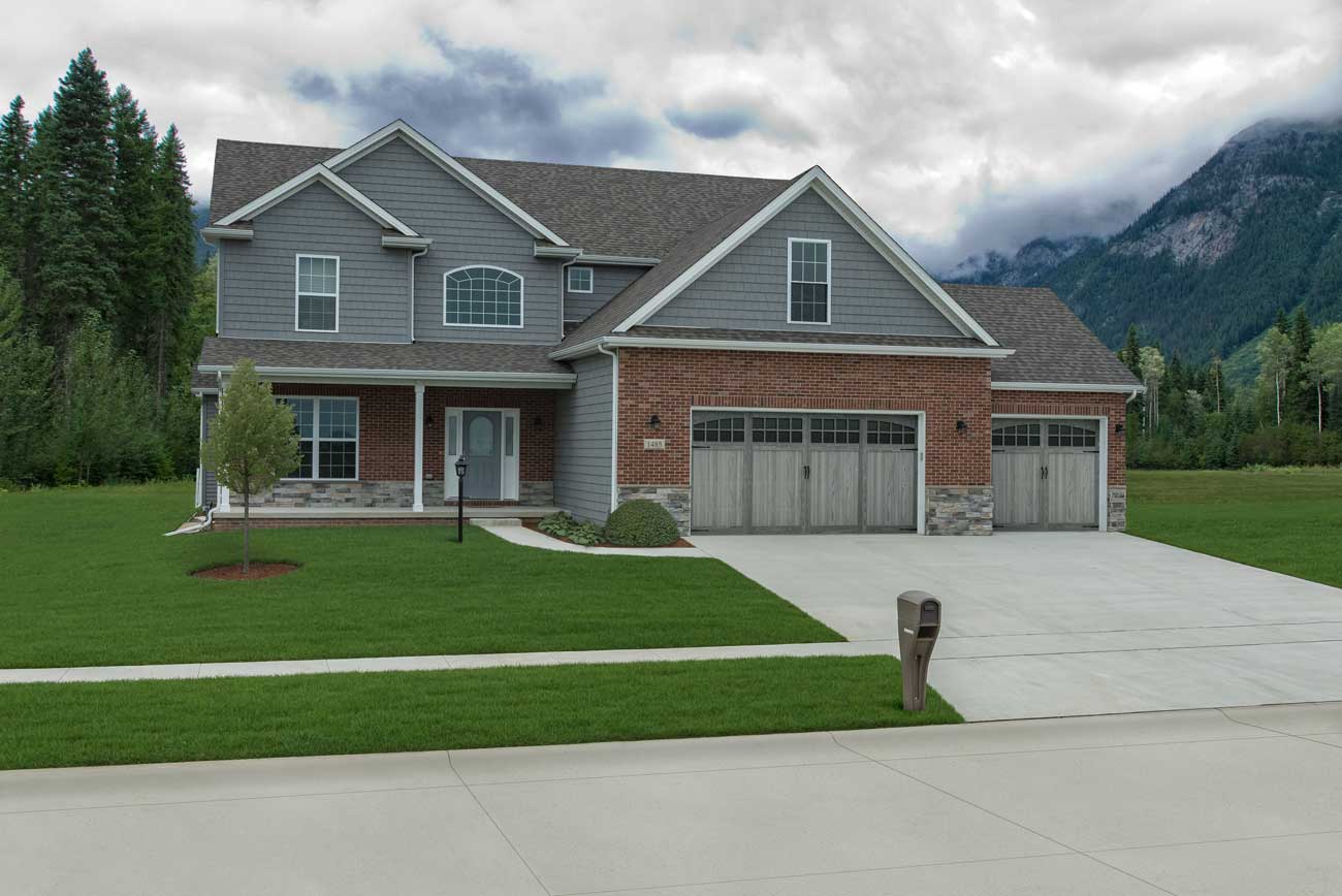 This is an image of a carriage house door with windows in the driftwood color.