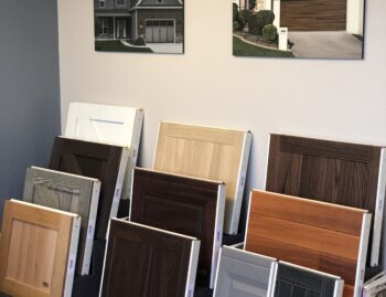 This is an image of some garage door panel samples of various styles and colors at the Entry Systems design center in Laguna Hills, California.