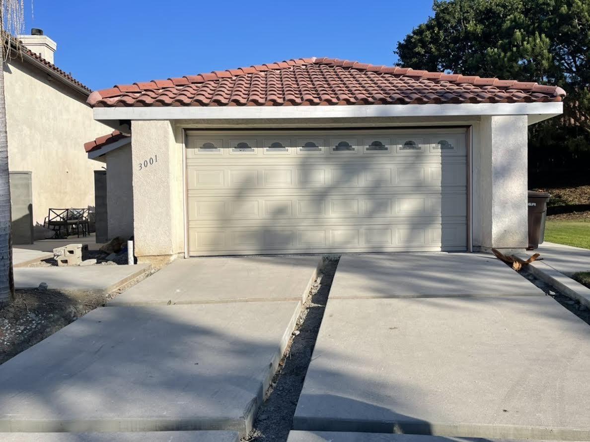 Before image of a white short panel garage door in San Clemente