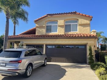 This is an image of a brown raised panel garage door in Laguna Niguel, CA.