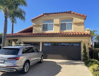 This is an image of a brown raised panel garage door in Laguna Niguel, CA.