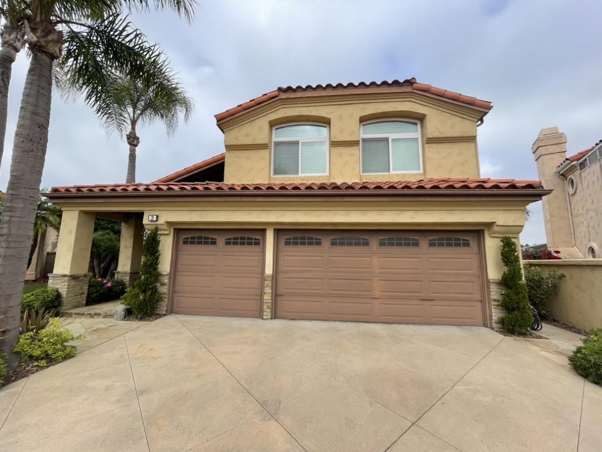 Brown Garage Door with faded paint and older design
