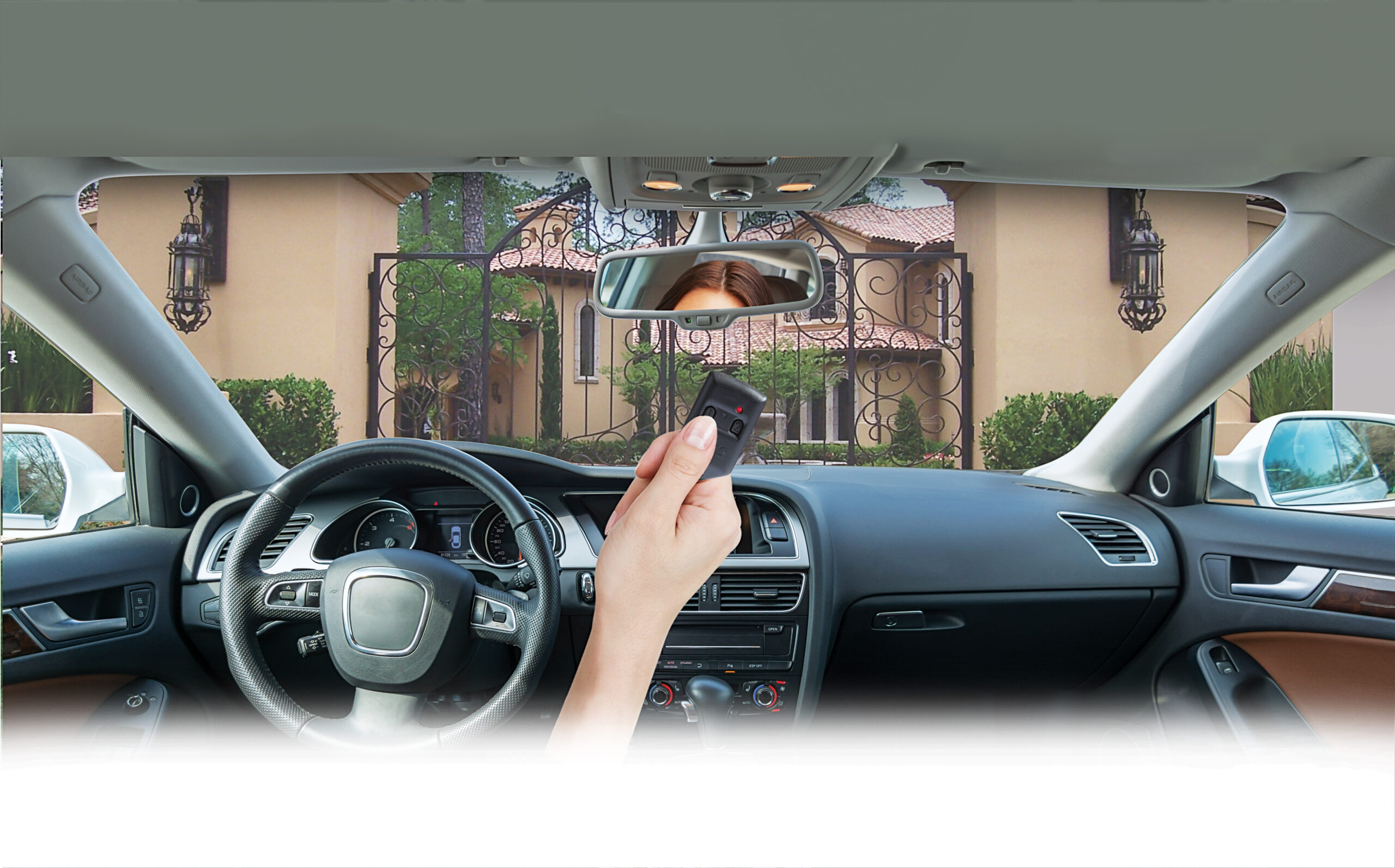 This is an image of a woman holding a small gate remote to access her community gate in Orange County, CA.