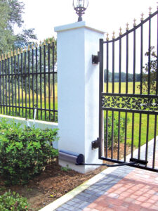 This is an image of a black steel automatic residential gate.