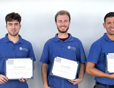 This is a picture of five of our garage door technicians holding up their certificates that they passed accreditation tests.