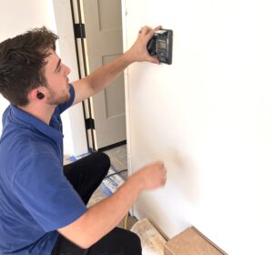 garage door installer is mounting a 880lm for wheelchair use