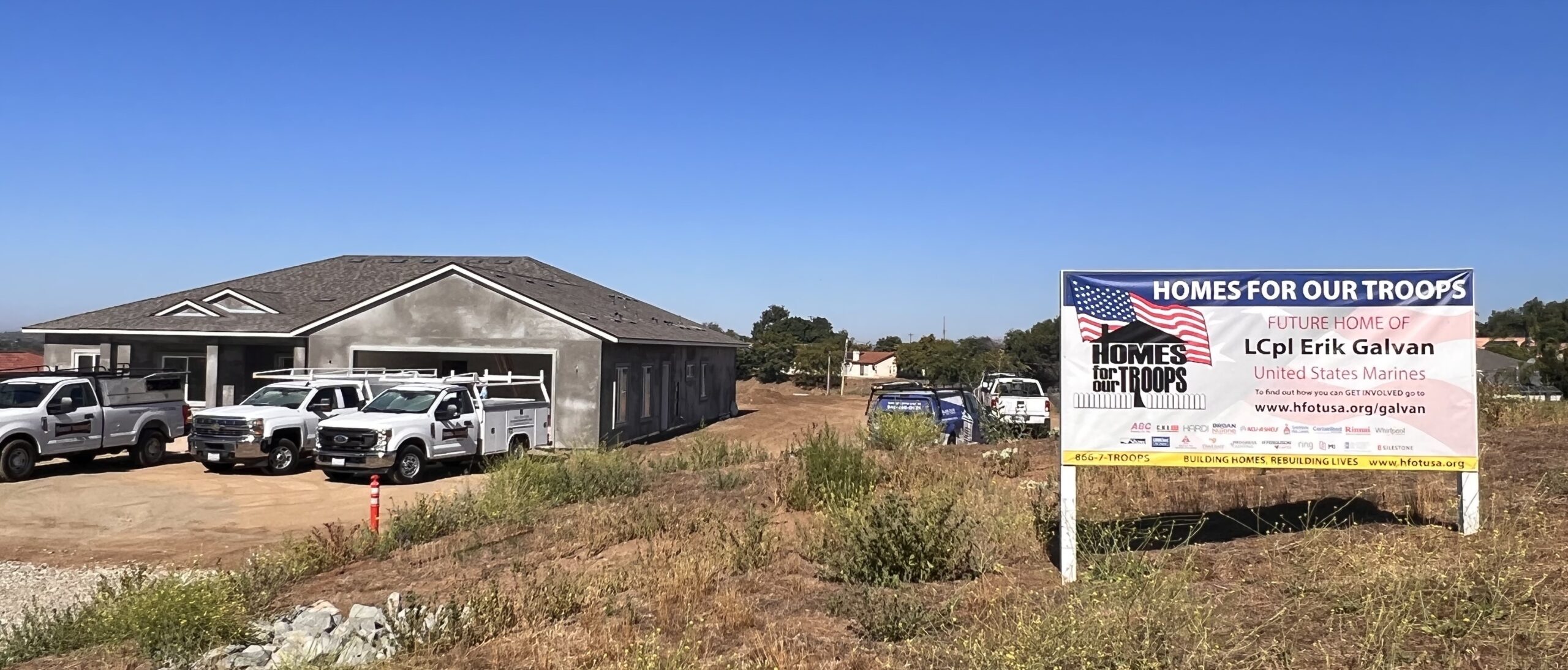 Image of Home in Construction with HFOT sign in front of it.