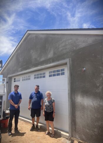 Image of Fallbrook Garage Door Job after installation is completed with two installers and owner.