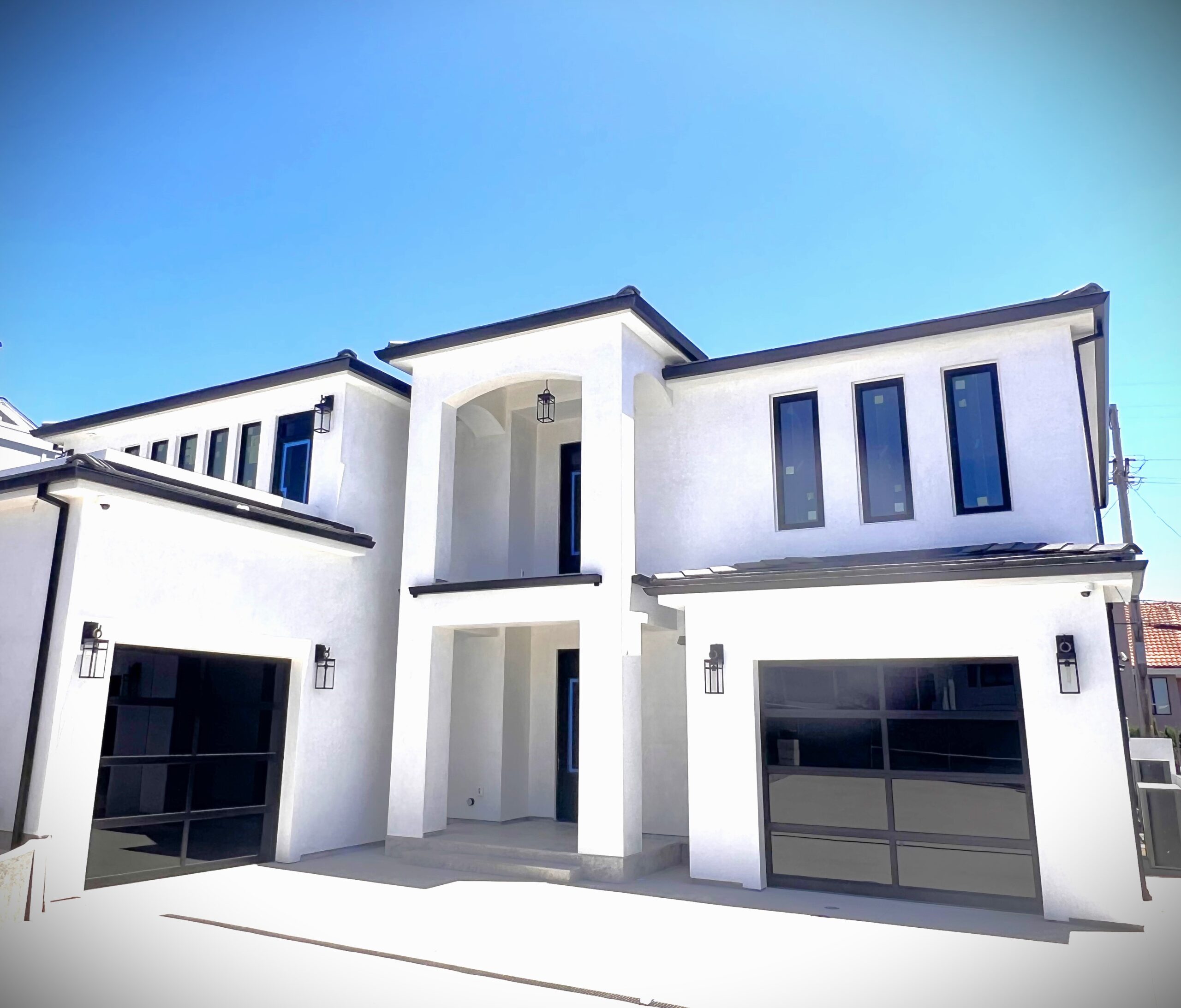 After image of new glass black garage door installation in Dana Point.