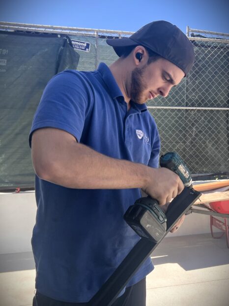 Garage Door Technician preparing doorstop for installation