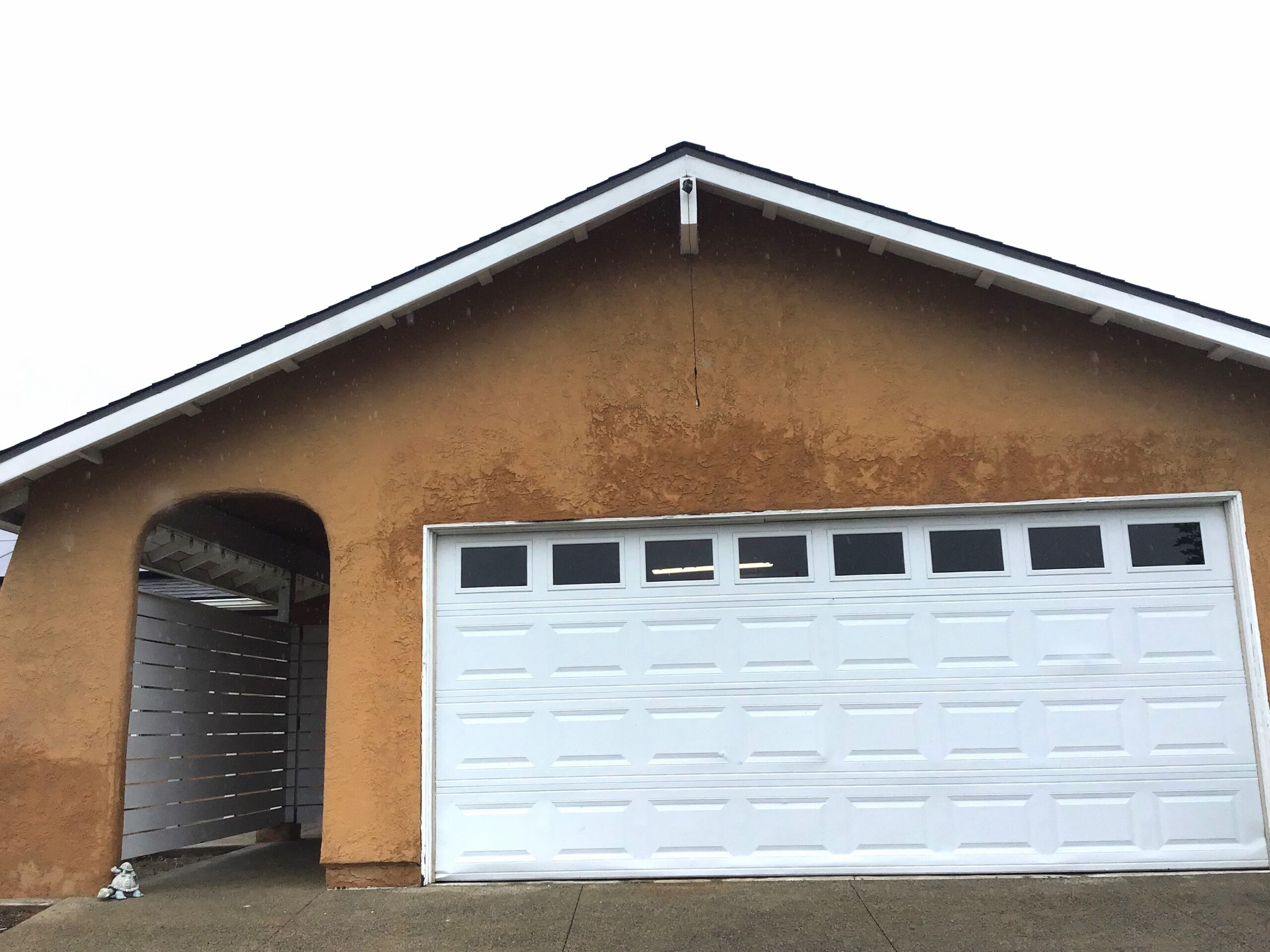 Picture of before garage door white panel garage door installation in Mission Viejo, CA.