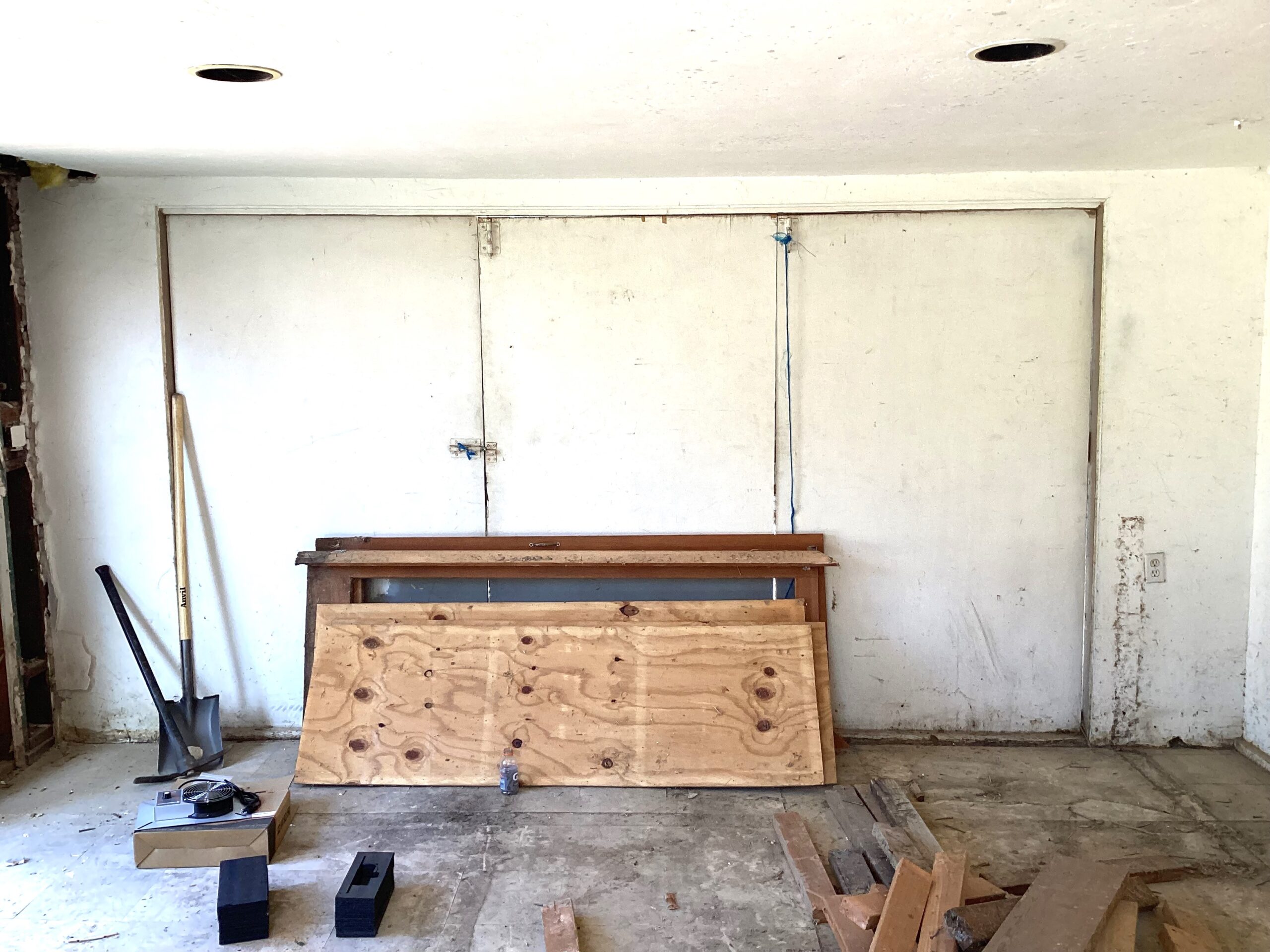 Inside of garage getting ready for one piece to roll up garage door conversion