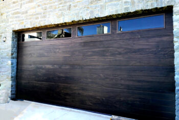 Before version of home in san clemente after new garage door install with new modern plank style.