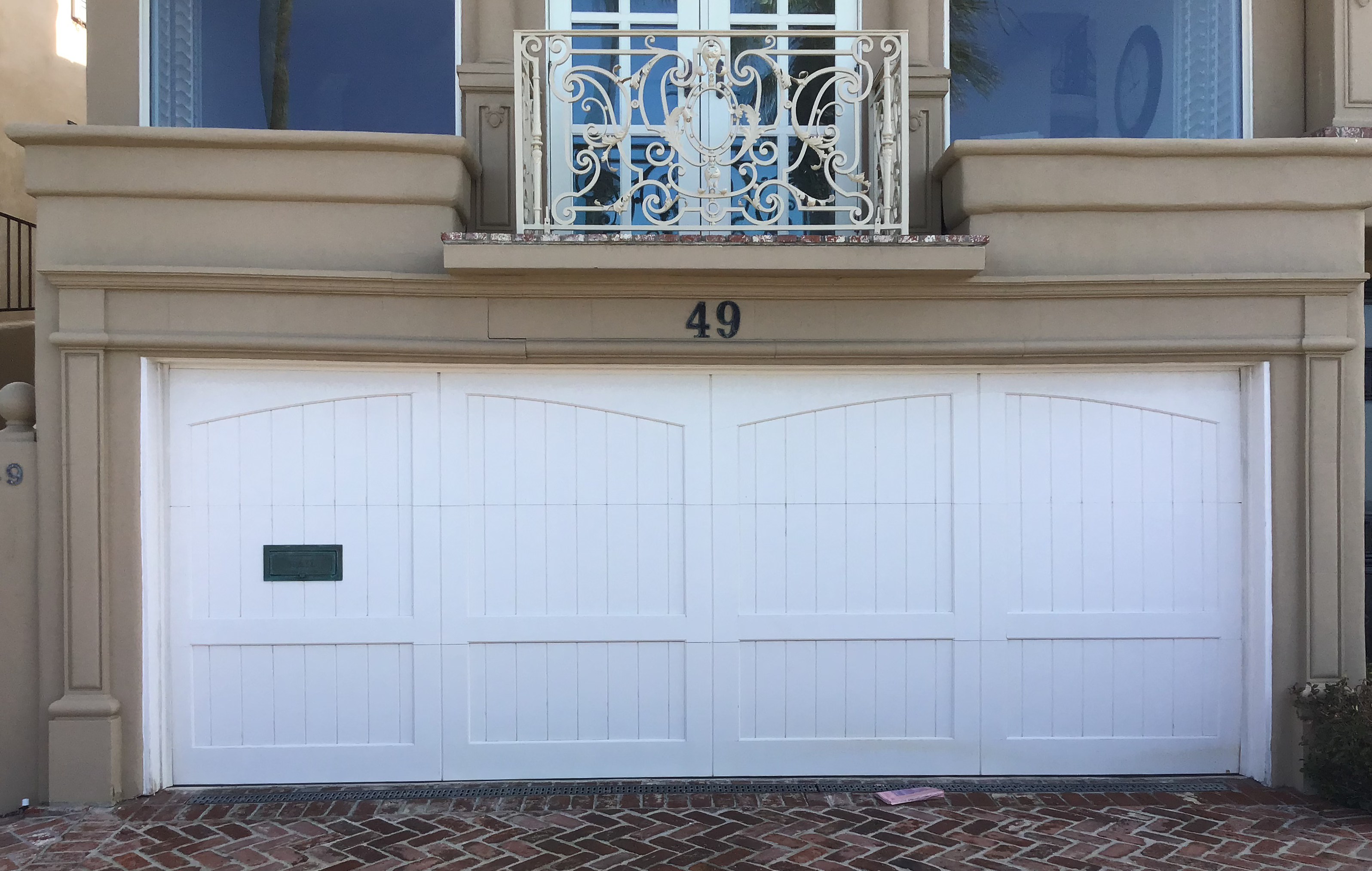 White custom wood garage door in Laguna Beach CA