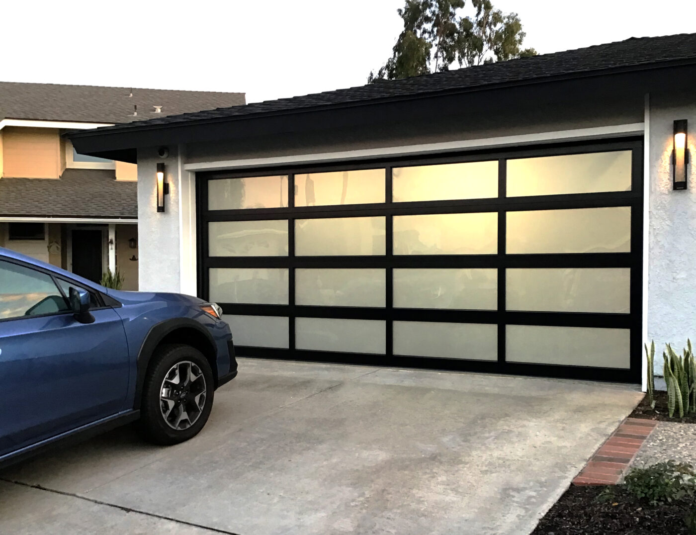 Image of modern glass garage door install in Dana Point- after image.