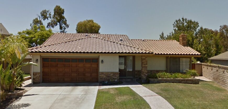 Image of wood sectional before garage door project in Dana Point, CA.