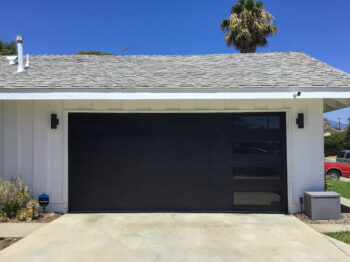 black garage door with vertical right windows after install