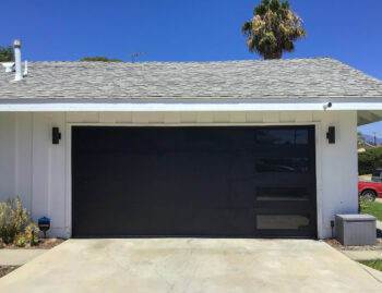 black garage door with vertical right windows after install