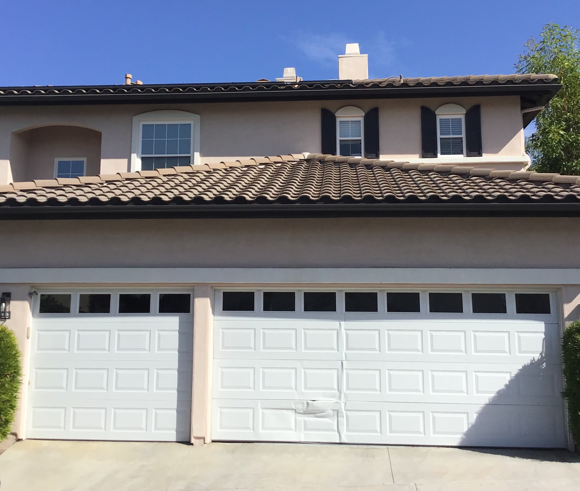 dented garage door in Trabuco Canyon before shot