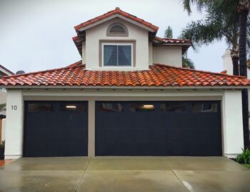 black garage door remodel in Laguna Niguel with windows