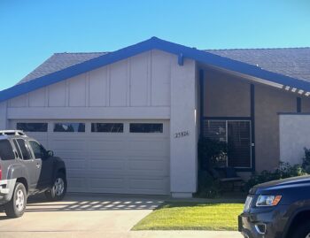 Tan Long Panel garage door with windows in San Juan Capistrano