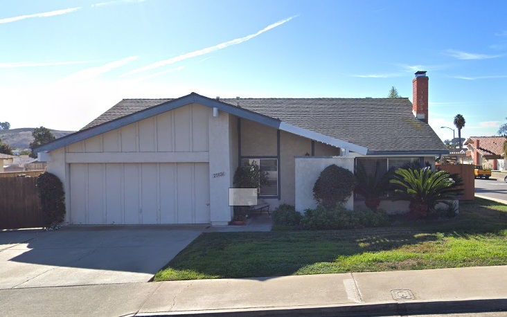 One piece wood garage door in San Juan Capistrano- white color.