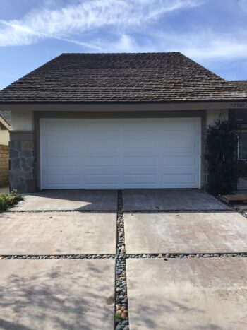 white long panel garage door installation in Dana Point