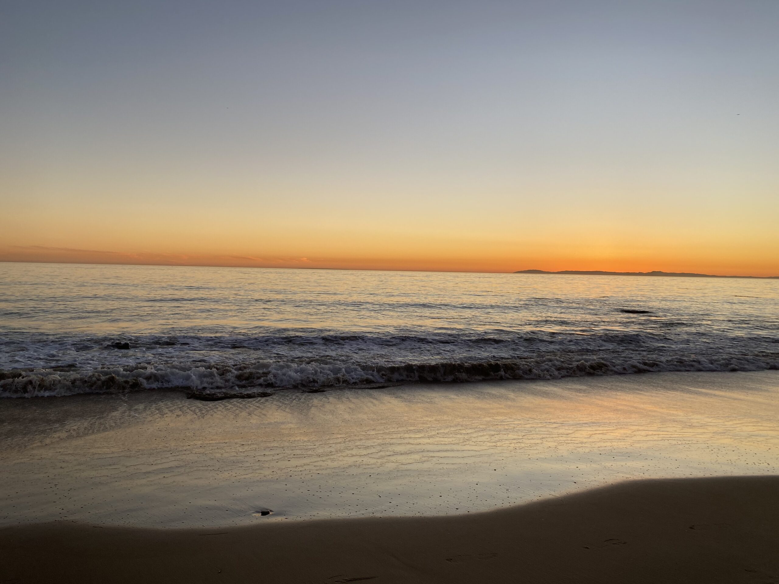 Newport Beach coastal sunset with waves