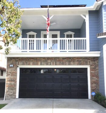black raised panel garage door with windows before retrofit shot in coto de caza