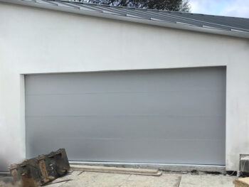 silver modern flush steel garage door in laguna beach ca