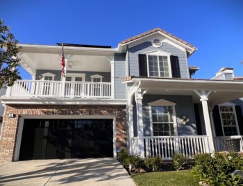 after shot of black overlay steel garage door with windows in coto de caza