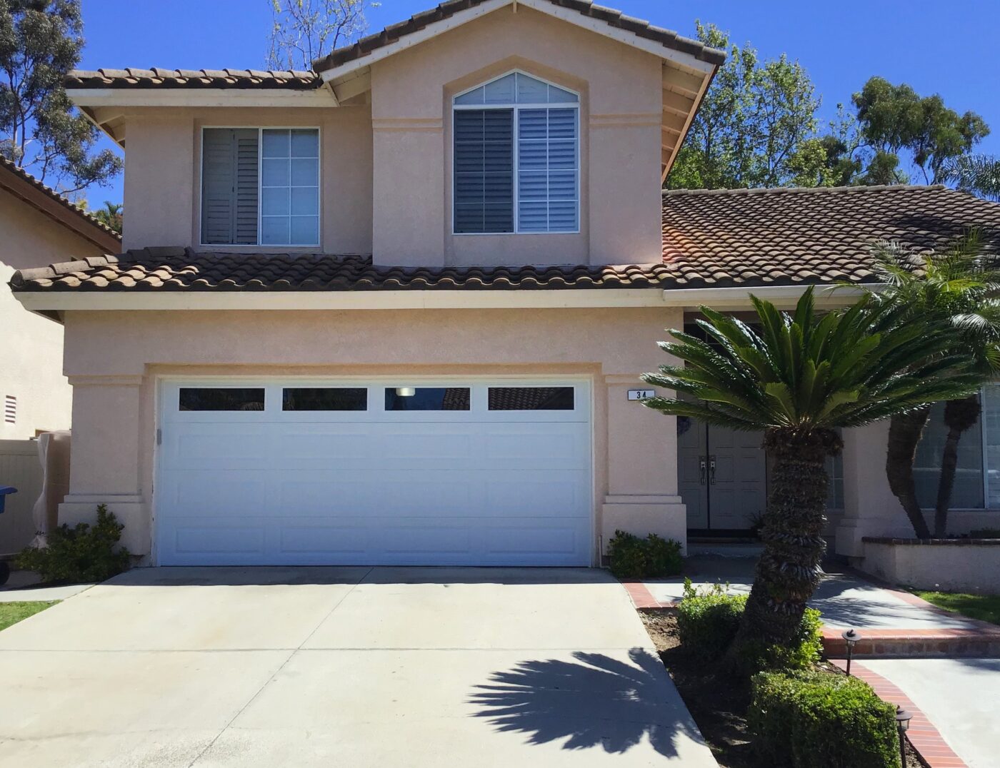 White long panel garage door with windows in Aliso Viejo after image