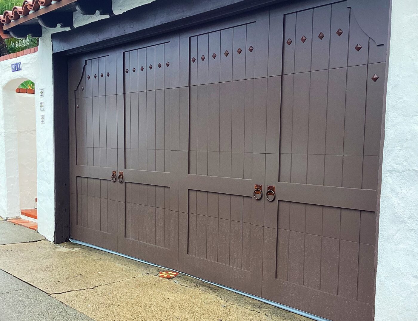 spanish style brown wood overlay garage door san Clemente after retrofit