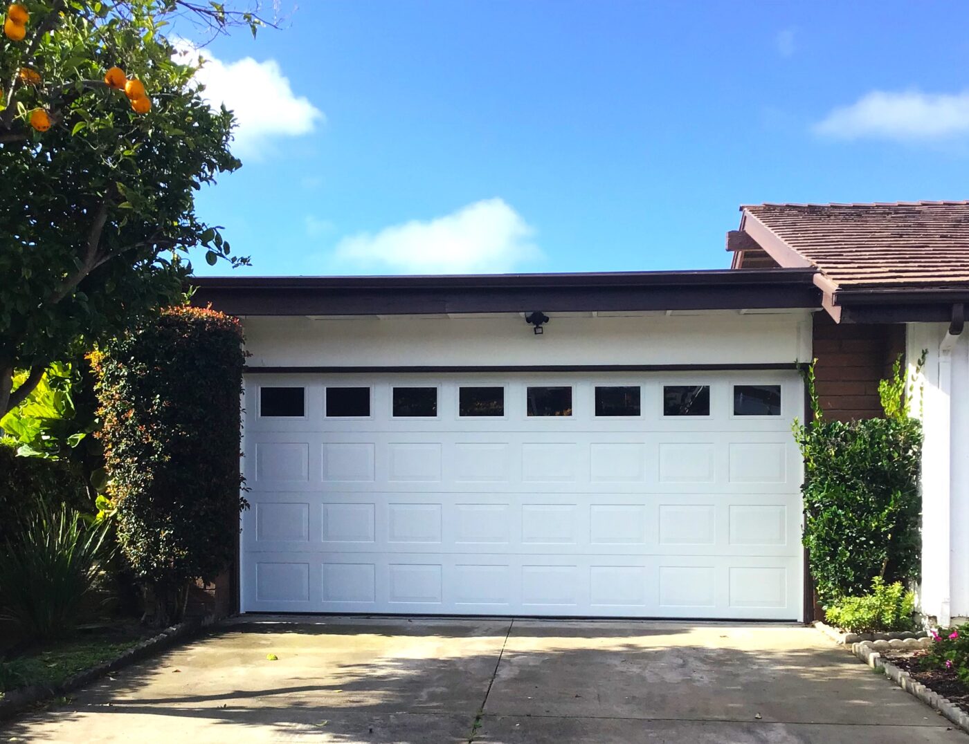 Brand new replacement after image garage door that is white in San Clemente short panel with windows