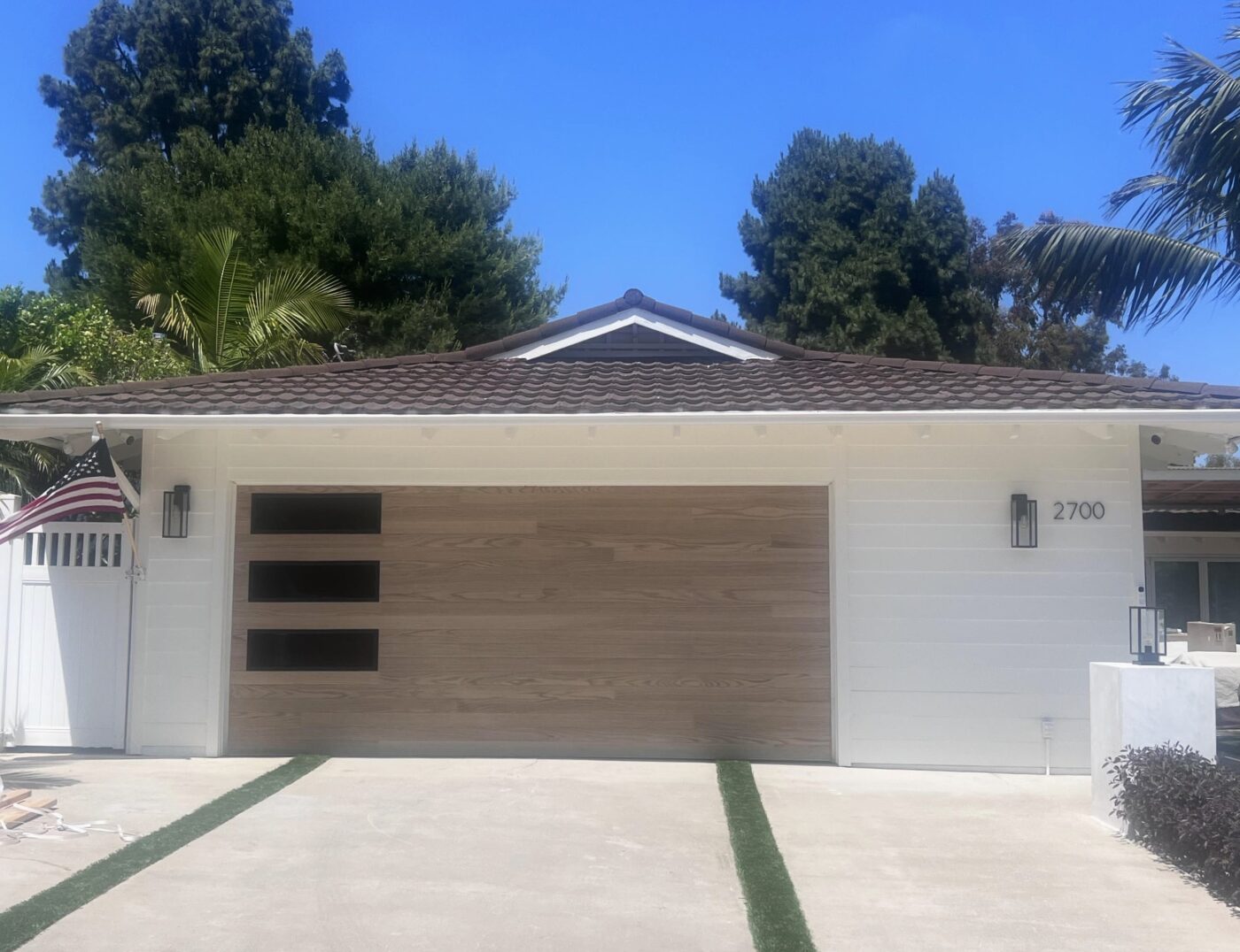 natural oak garage door installed in san clemente on modern home