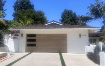 natural oak garage door installed in san clemente on modern home
