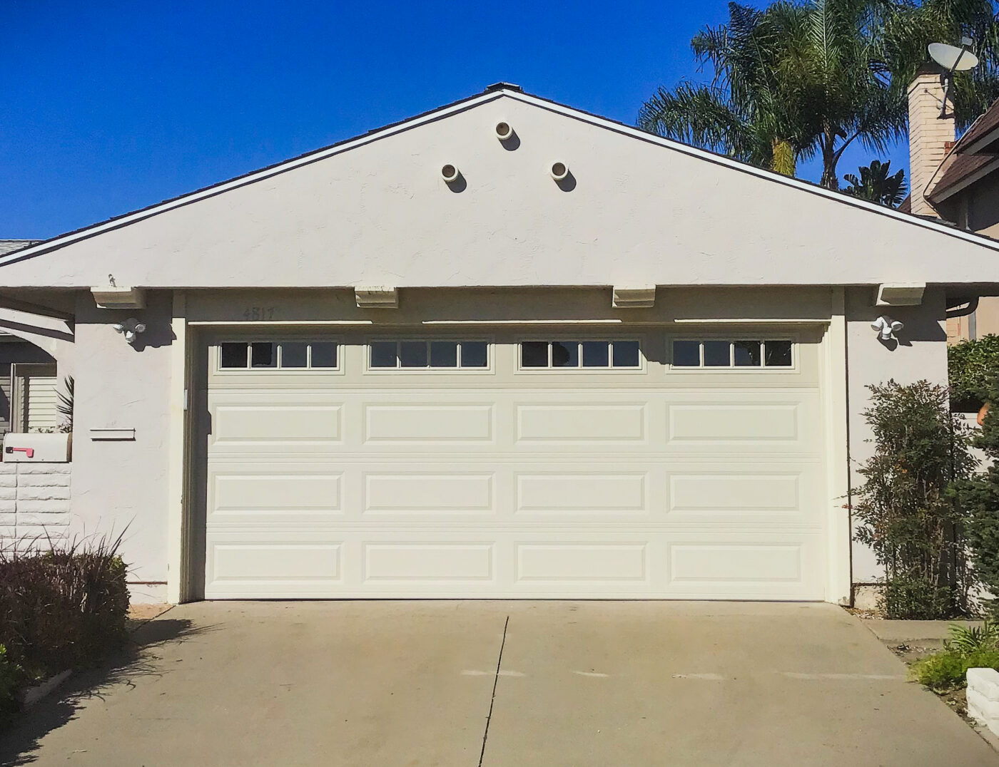 New white long panel garage door installation in Seal Beach, CA