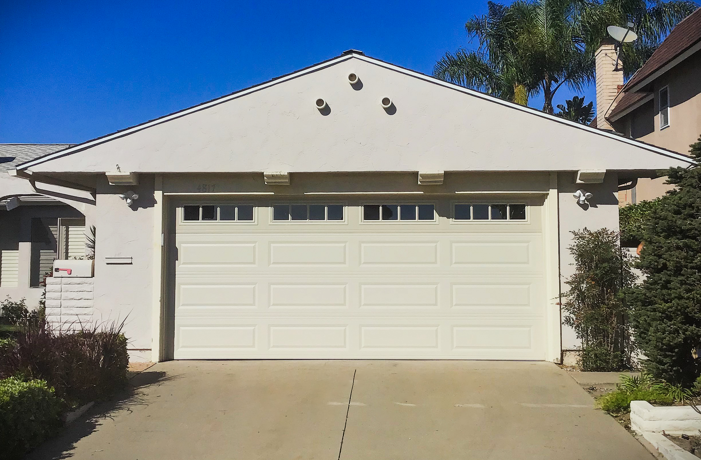 New white long panel garage door installation in Seal Beach, CA