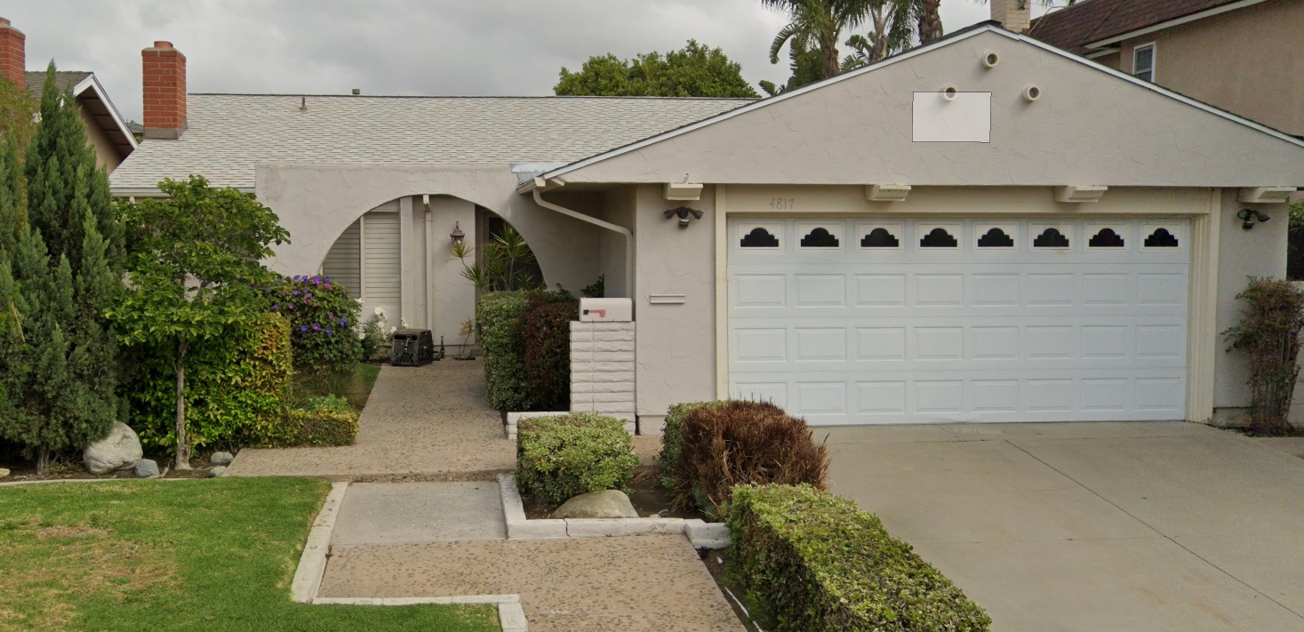 Short panel traditional garage door before retrofit in Seal Beach CA with windows