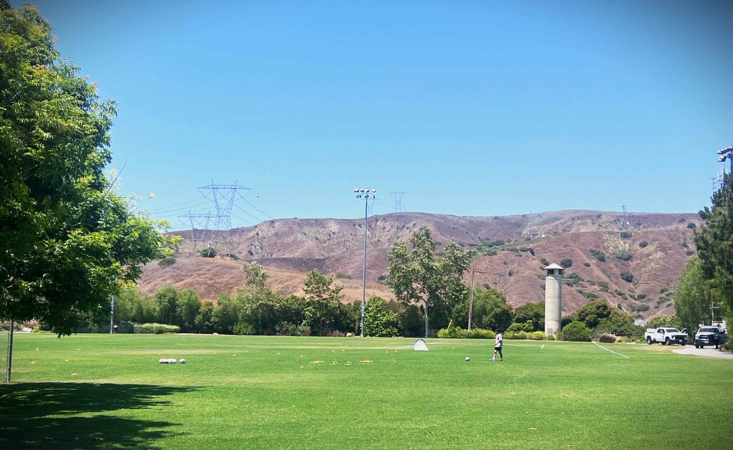 Park in Yorba Linda was man playing soccer in front of hills
