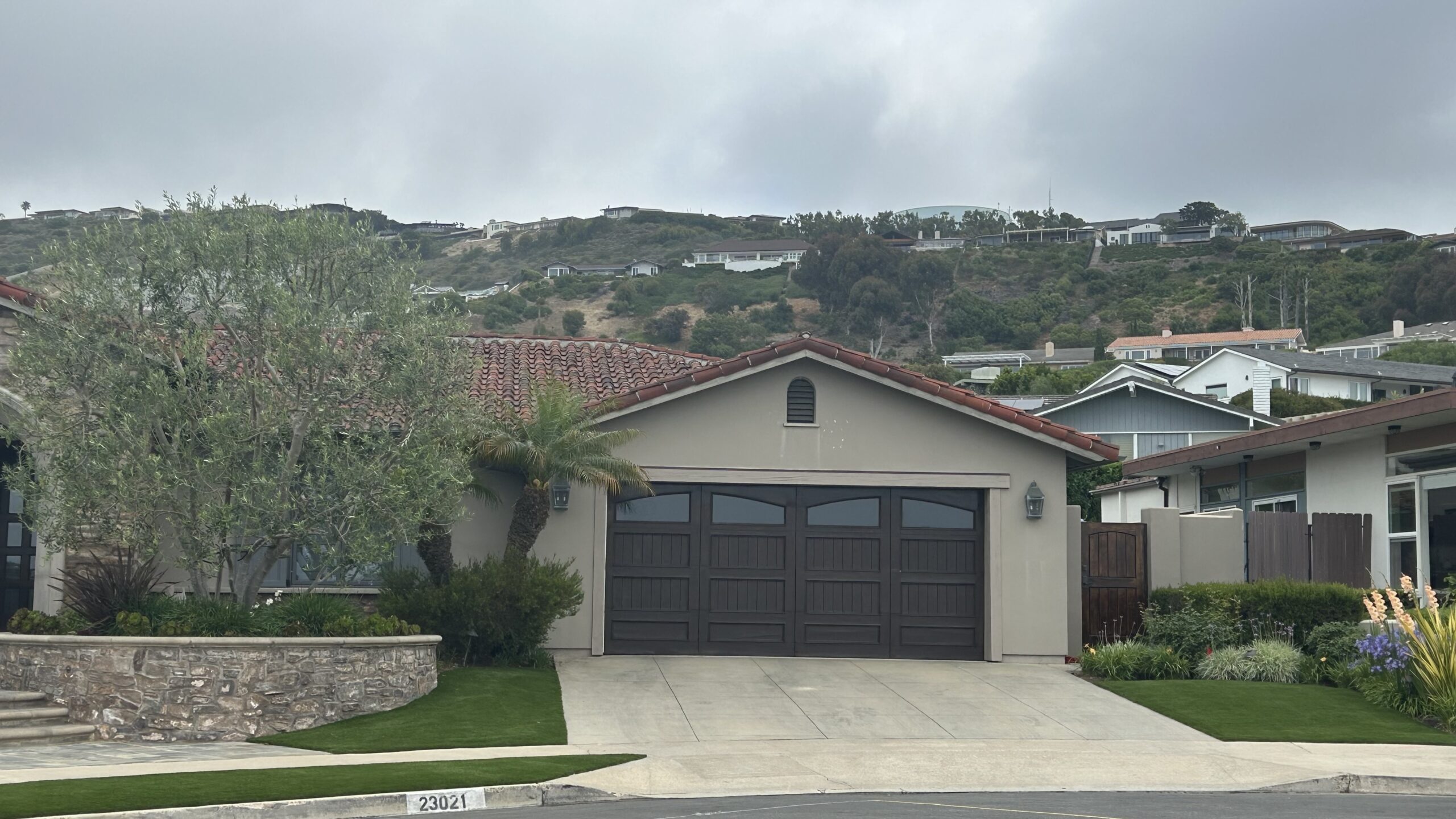 brown carriage house garage door in dana point before retrofit