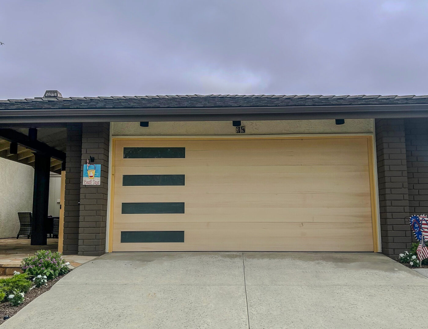 Custom Wood Oak Garage Door retrofit with vertical windows