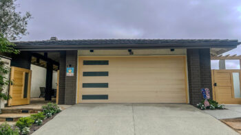Custom Wood Oak Garage Door retrofit with vertical windows