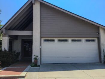 Almond Stamped Carriage House Garage Door with Prairie Windows