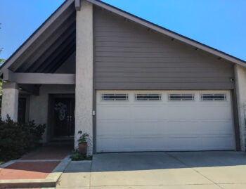 Almond Stamped Carriage House Garage Door with Prairie Windows