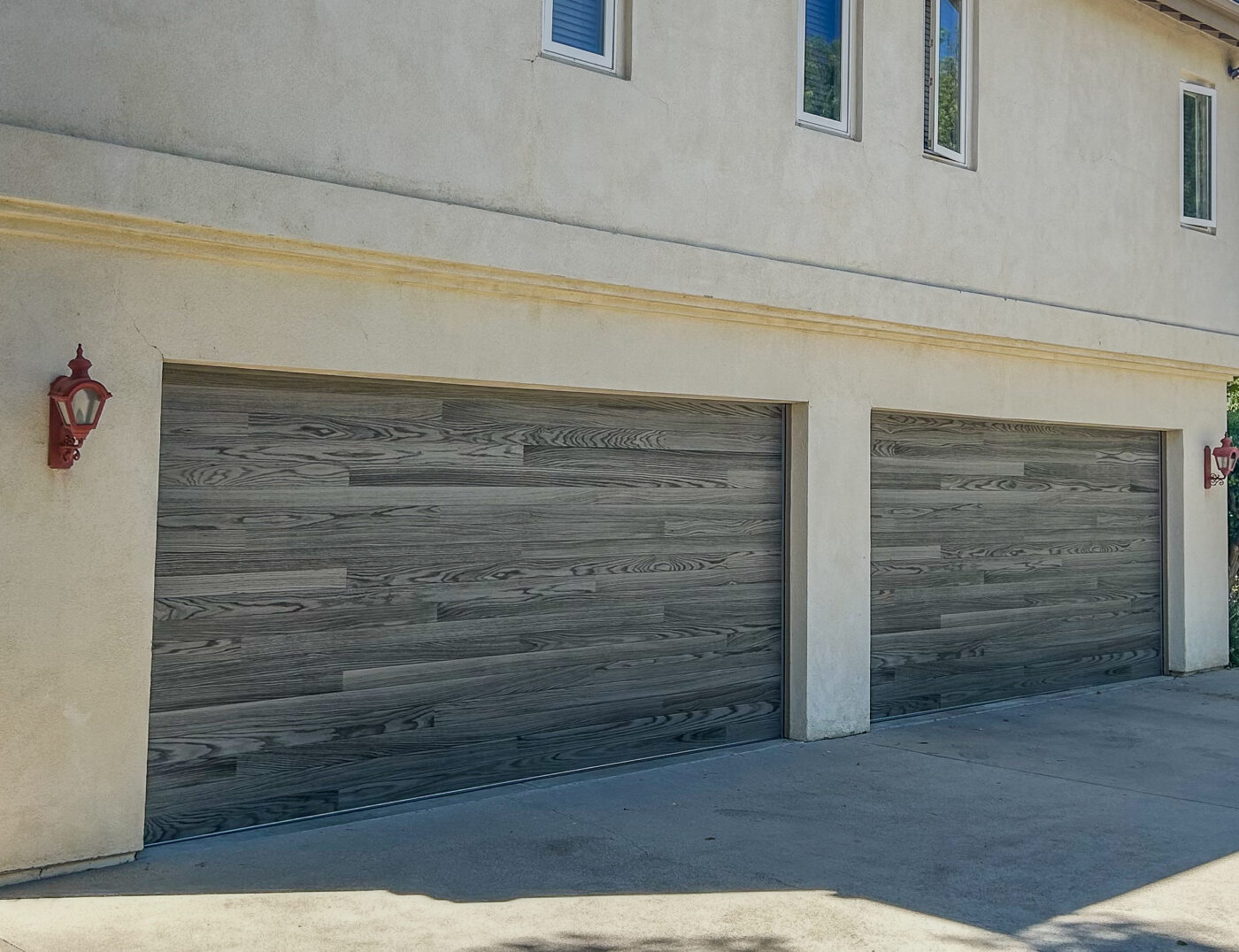 new garage door installation with faux driftwood color